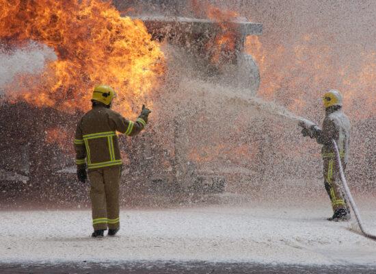 firefighting team fighting a fire with AFFF firefighting foam