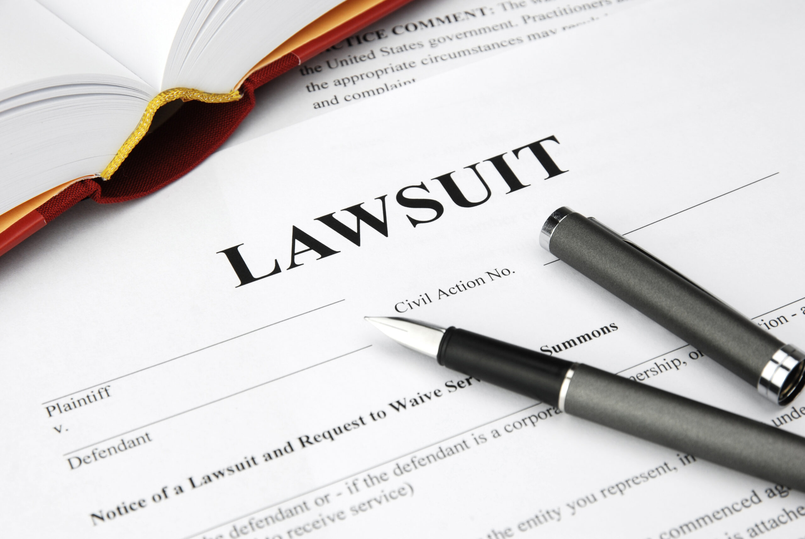 lawsuit form with filler and book