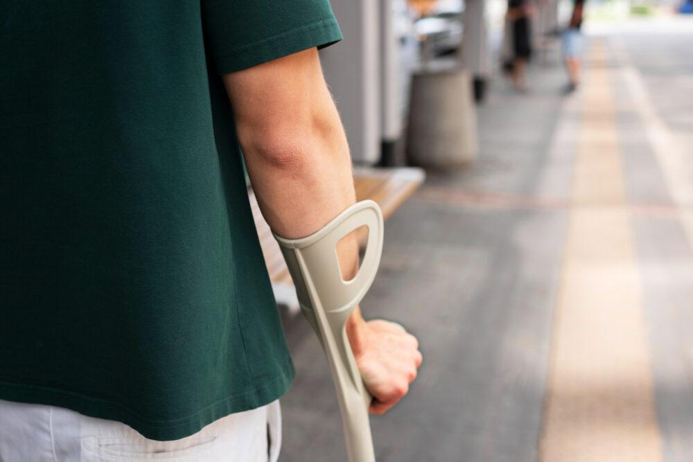 injured person on crutches