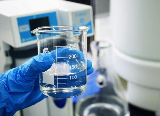 Water in a glass beaker being tested for 1,4 Dioxane