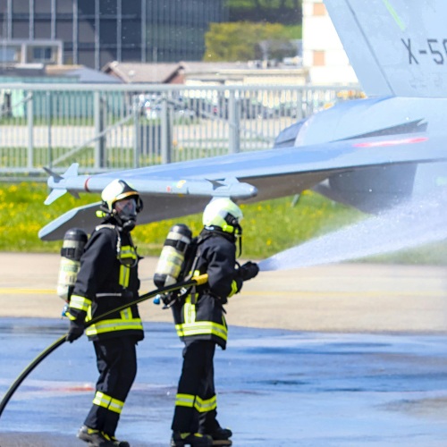 firefighters using afff at an airport