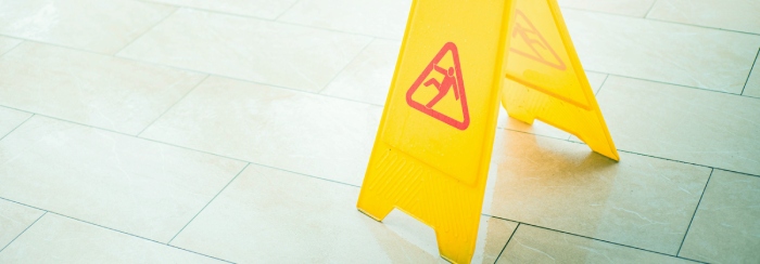 wet floor sign on a wet floor
