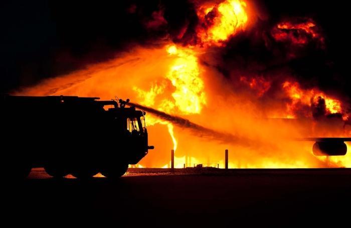 a firetruck battling a blaze using afff with pfas which can be dangerous and costly to clean up