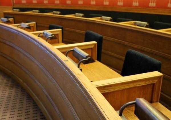 a photograph of empty seats in a jury box inside of a court room in louisiana